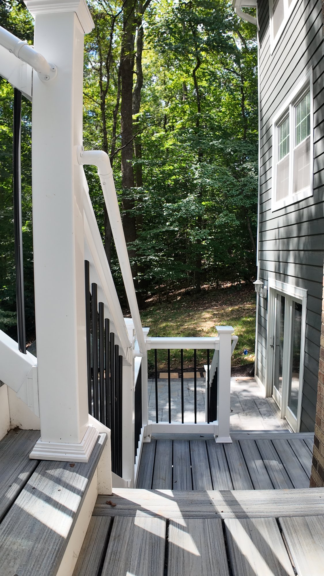 Custom cable railing composite deck built by Stoneridge adding value to Winchester Virginia home